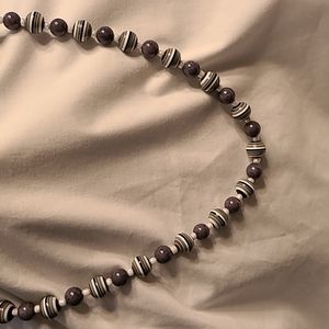 Handcrafted necklace with gray and white beads. 25 inches